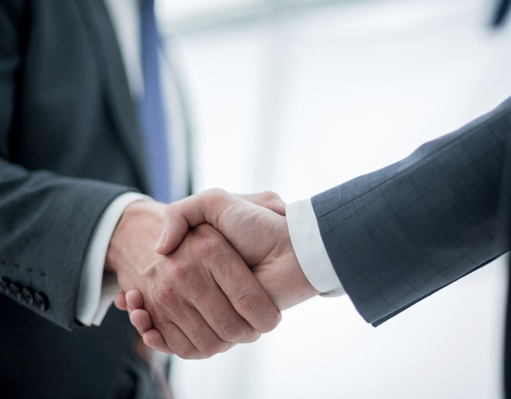 close up. handshake of business people on a light background.