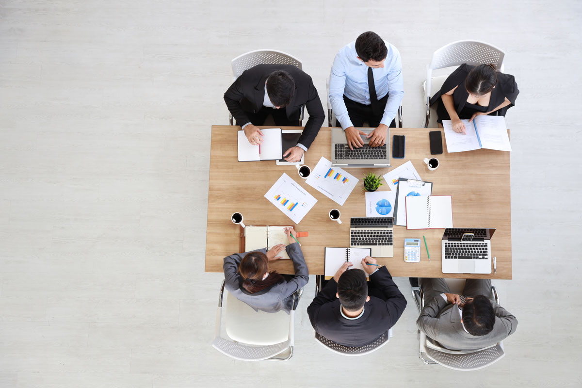 view from the top of business people in meeting room with copy s