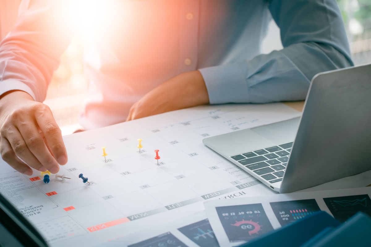 business man with laptop, calendar in office, business managemen